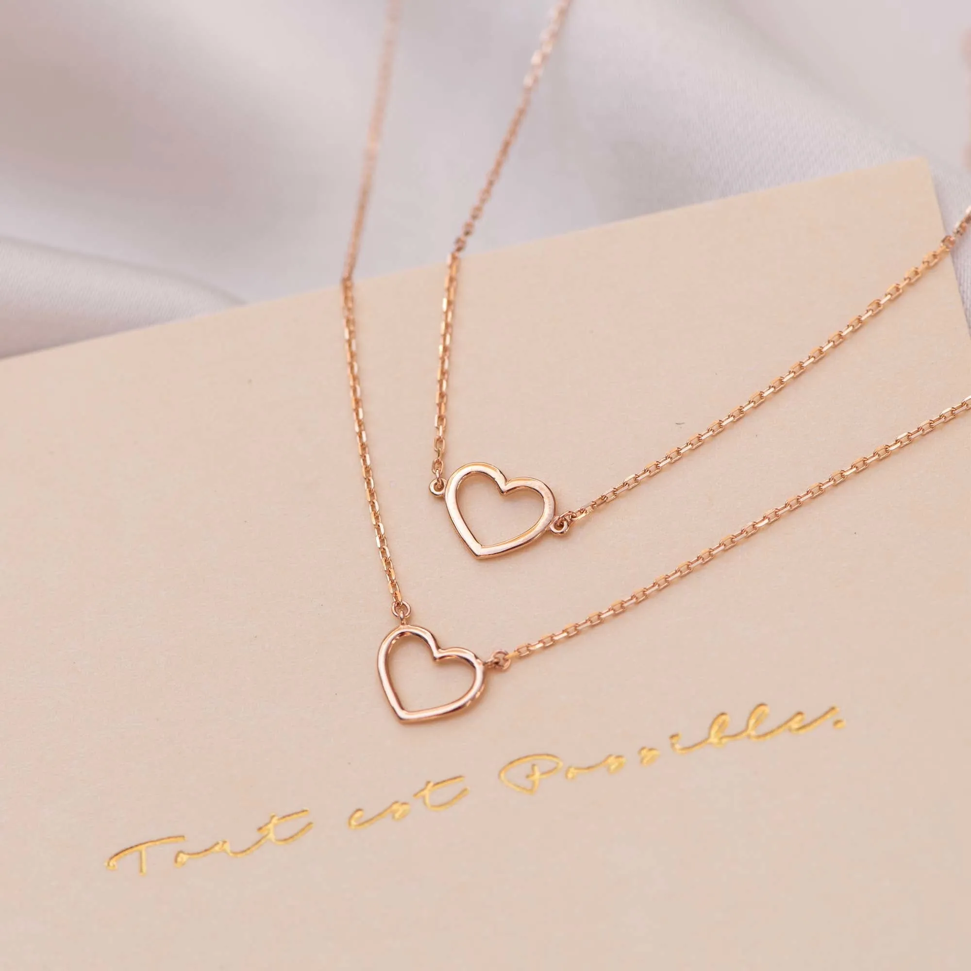 Cadeau d'Isabel 14 karat rose gold necklace & bracelet set with heart