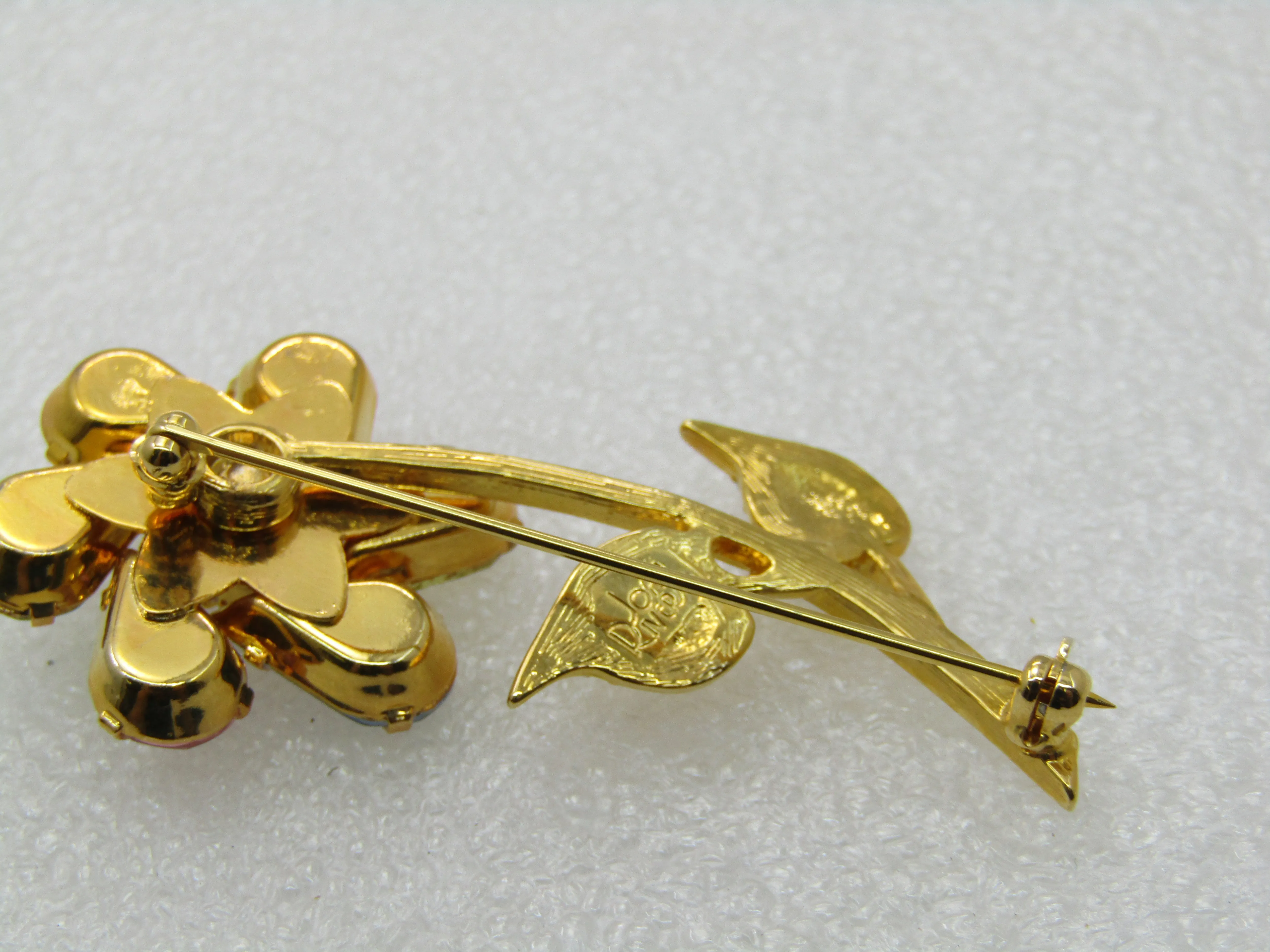 Vintage Joan Rivers Rhinestone Spinning Floral Brooch, Pinwheel, Pastels, gold tone. 2.5"