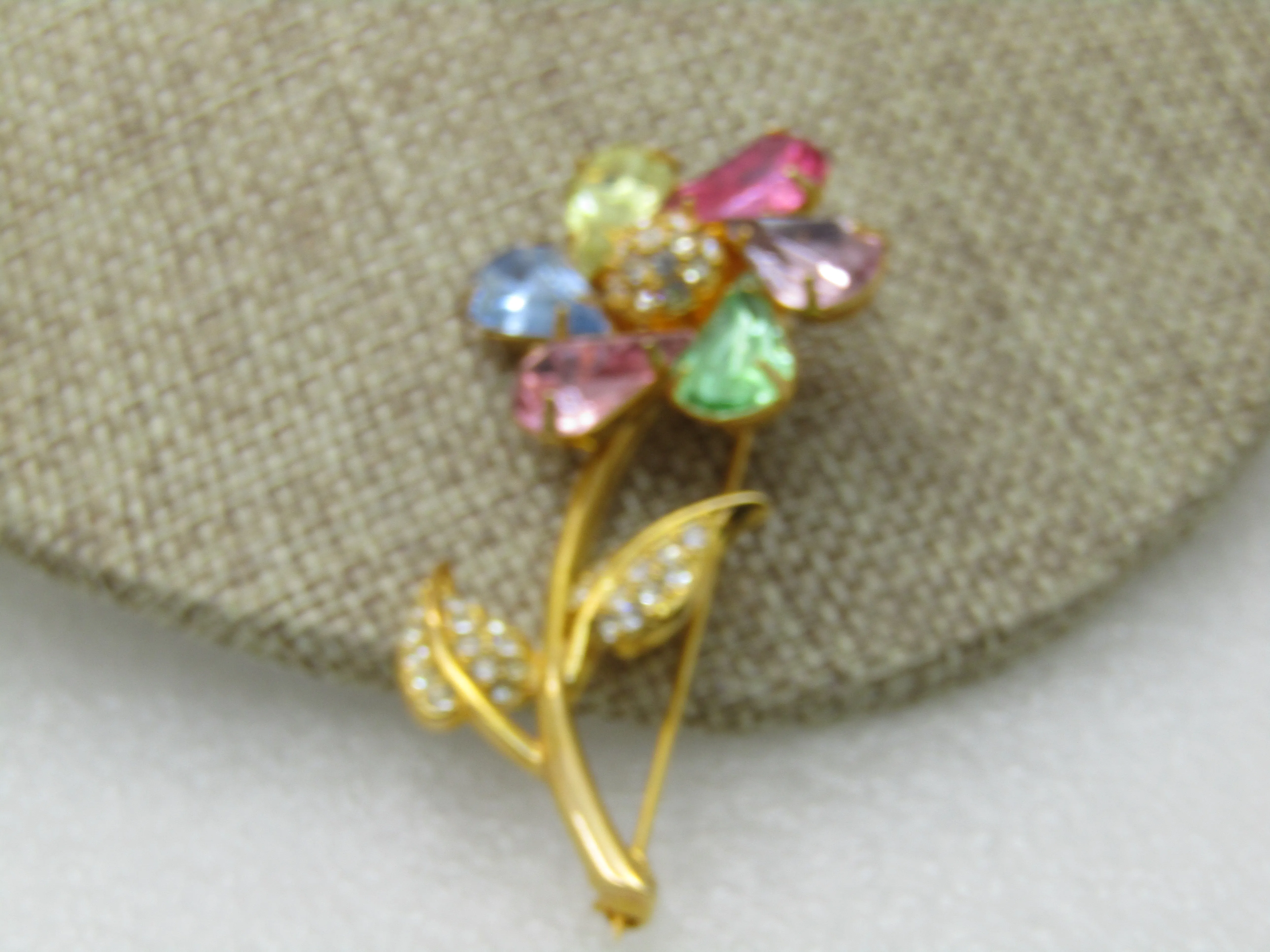 Vintage Joan Rivers Rhinestone Spinning Floral Brooch, Pinwheel, Pastels, gold tone. 2.5"