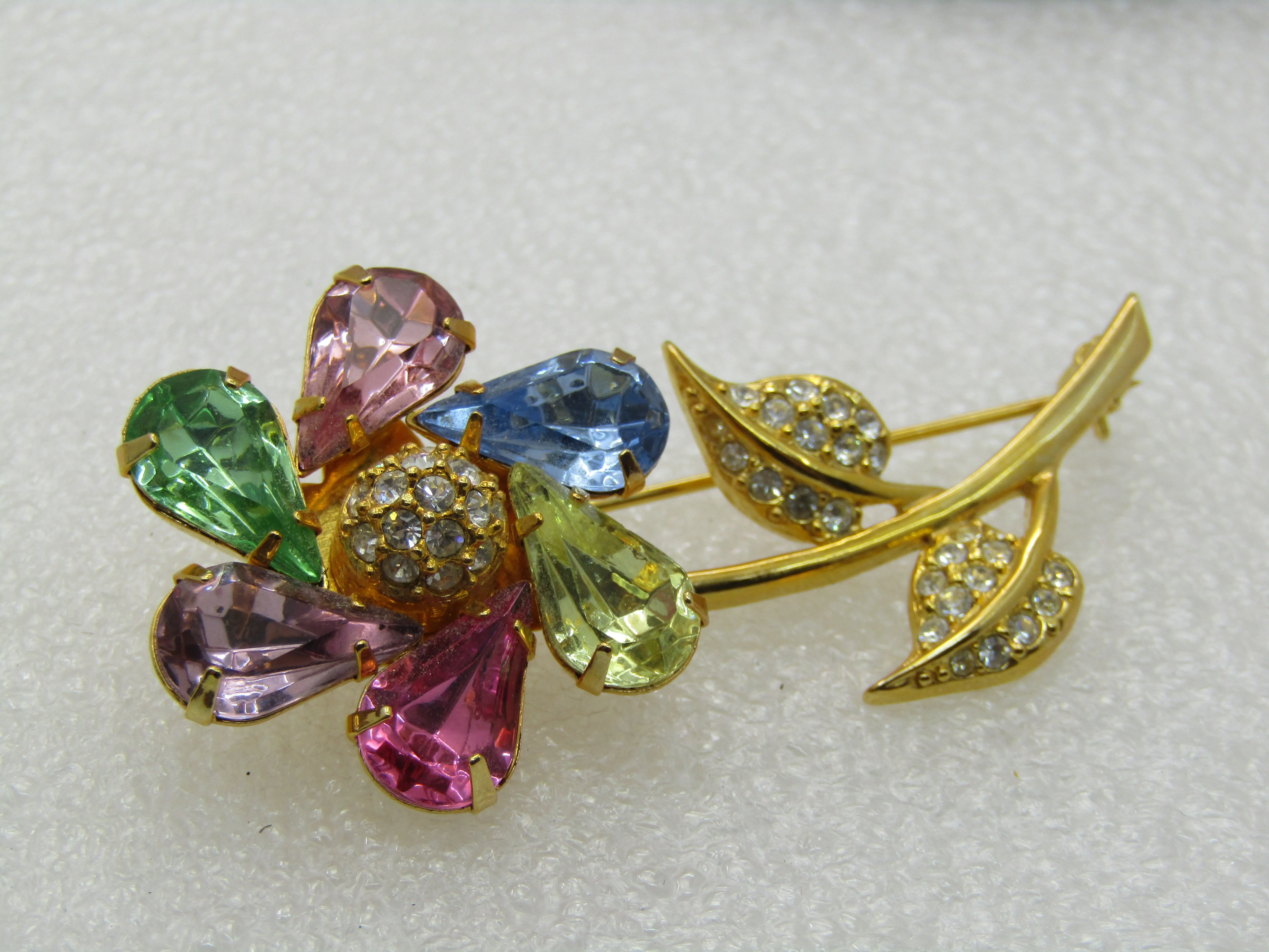 Vintage Joan Rivers Rhinestone Spinning Floral Brooch, Pinwheel, Pastels, gold tone. 2.5"